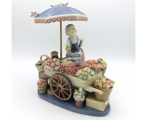 A Lladro porcelain figure group 'Flowers of the Season' model no. 1454, 265mm tall x 250mm across base, no losses, damage or 