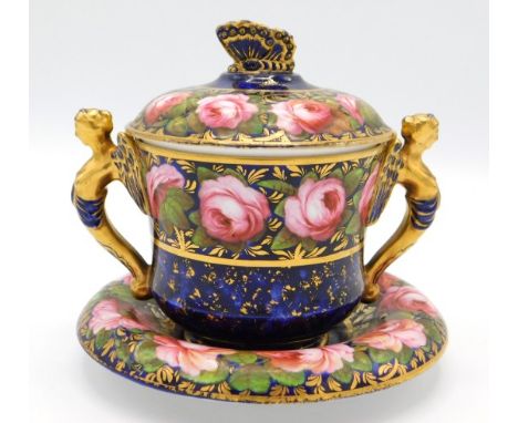 A c.1820 Spode chocolate cup & saucer decorated with roses & gilding on cobalt ground with butterfly on lid & gilded handles 