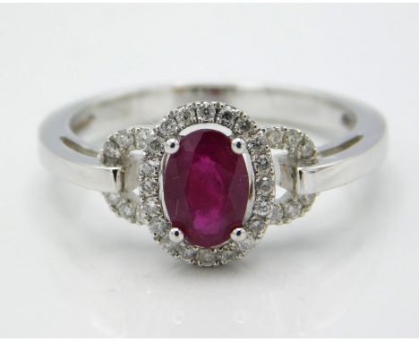 An 18ct white gold ring set with ruby & approx. 0.16ct of diamond, 4.2g, size N/O