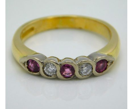 An 18ct gold pave set diamond & ruby ring with approx. 0.15ct of diamond, 4.9g, size N