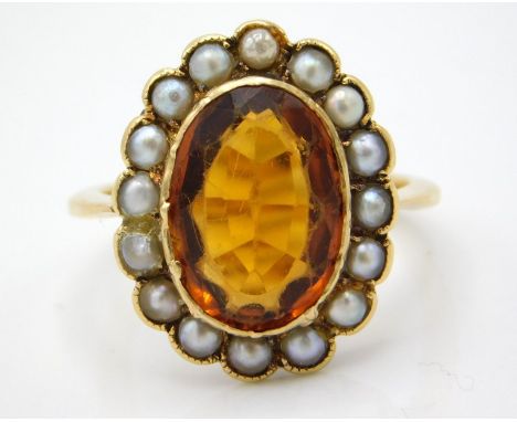 An antique yellow metal ring set with pearl & citrine, tests electronically as 14ct gold, 7g, size O/R