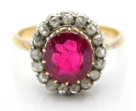 An antique 18ct gold ring set with ruby & seventeen rose cut diamonds, ruby 9mm x 8mm, 4.4g, size Q/R