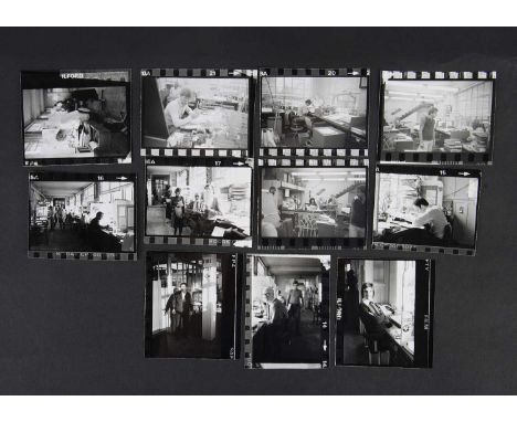 An interesting collection of black and white photographs, taken in the Bradbury Wilkinson offices, showing staff and craftsme