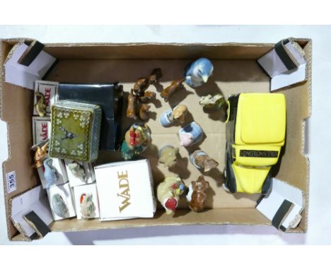 A collection of Wade pottery including Wimsies, teddies, dog figures, penguin decanter, Ringtons tea jar, van storage jar, sm