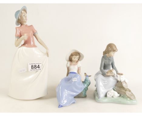 A collection of Nao pottery continental figures of young seted girl, girl with rabbit and standing lady with posy (3)