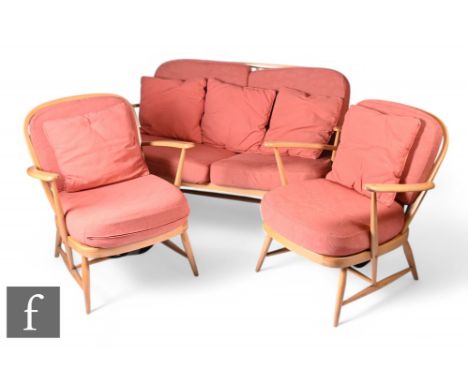 Lucian Ercolani for Ercol Furniture - A lounge suite comprising a pair of beech framed model 334 Windsor easy chairs and a mo