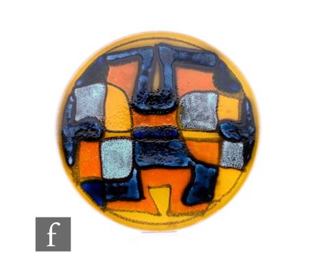 Ruth Paveley - Poole Pottery - A Delphis dish, of footed circular form, geometric outlined forms in blue, orange, yellow and 