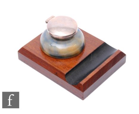 Martin Brothers - A stoneware inkwell of compressed hemispherical form with domed well, mottled brown and blue glaze, silver 