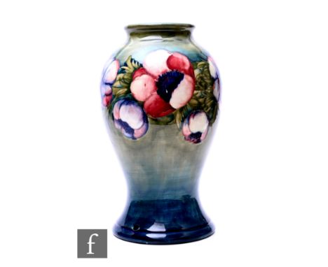 William Moorcroft - Moorcroft Pottery - A large Anemone vase, circa 1930, of baluster form, tubeline decorated with a band of