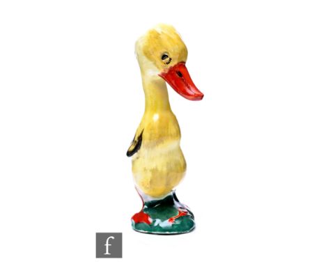 Clarice Cliff - Mr Duck - A novelty figure of a duck raised to a domed base with a worm, painted in colours, Wilkinson mark o