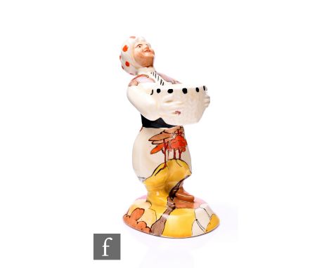 Clarice Cliff - Arab - Coral Firs - A novelty candlestick modelled as a standing Arab in pantaloons with sash and turban hold