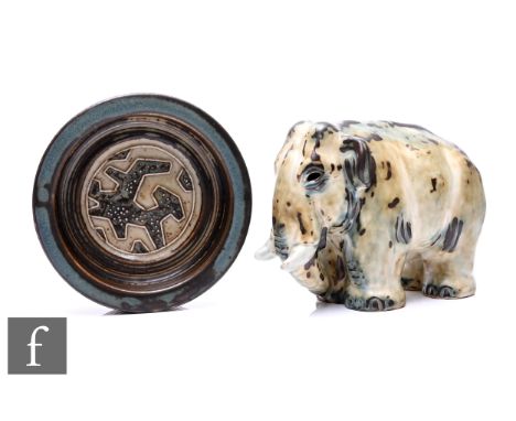 Jørgen Mogensen - Royal Copenhagen - A stoneware dish of circular form, the central roundel with tube lined geometric motif, 