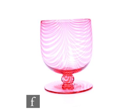 Harry Powell - James Powell and Sons, Whitefriars - An Arts and Crafts wine glass circa 1890, the tulip bowl with melted ruby