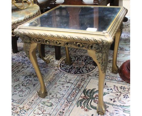 A gilt framed occasional table with a mirror top