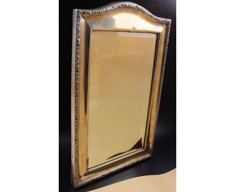 An early 20th century silver framed table mirror, inset bevelled glass, the back with easel stand, Chester 1912, overall 36cm