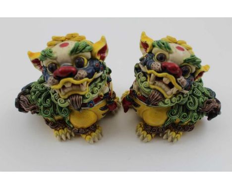 A pair of polychrome painted ceramic, seated Dog of Fo, shredded clay work, seal marks to base 10cm high