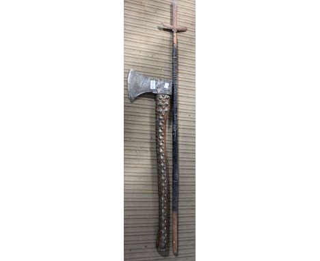 An axe, a  sword and two other weaponsCondition: Axe - head is named "Peugeot Freres", it has cast pitte surface, leather cov