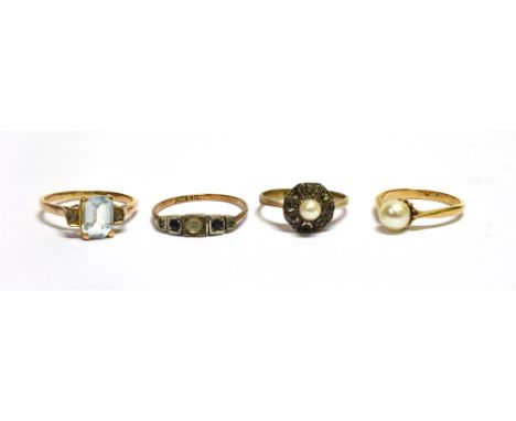 A GROUP OF FOUR GOLD AND GEM SET RINGS INCLUDING AN AQUAMARINE SINGLE STONE RING WITH ROSE DIAMOND SHOULDERS  the cut-corner 