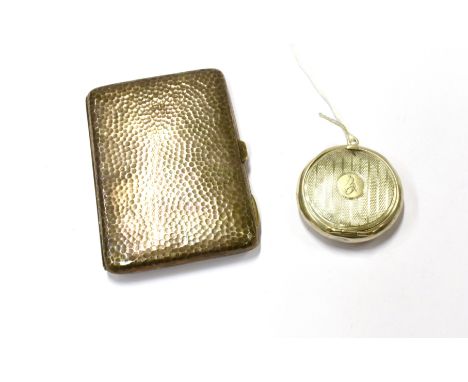 A hammered silver aide memoire and calling card case, Birmingham 1902; and a silver round compact, the hinged cover with engi
