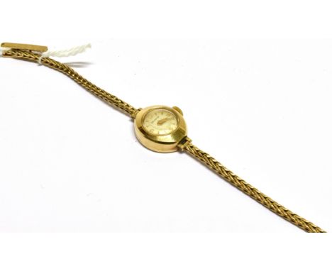 HELVETIA, A LADY'S SWISS 9CT GOLD SMALL ROUND BRACELET WATCH, CIRCA 1961 cream dial with raised gilt baton numerals and hands