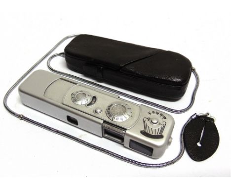 A MINOX B SUBMINIATURE CAMERA  in its leather travel case. 