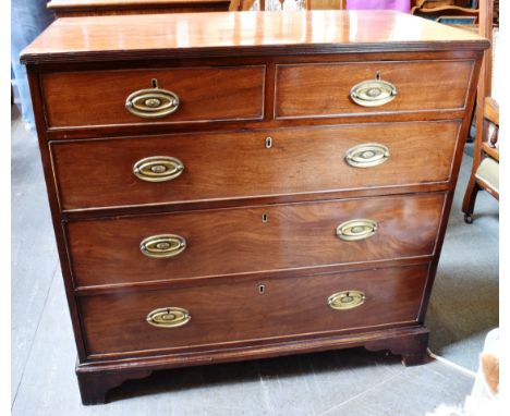AN EARLY 19TH CENTURY MAHOGANY CHEST OF TWO SHORT AND THREE LONG DRAWERS the top with reeded edge, on bracket feet, 97cm wide