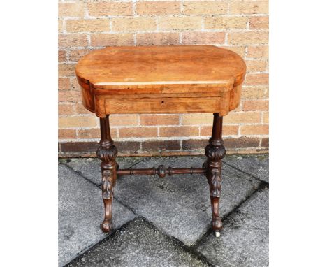 A VICTORIAN WALNUT SIDE TABLE  with inlaid decoration, the revolving and opening top with Chess/backgammon/cribbage board, on