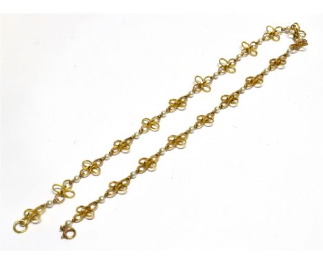 A VINTAGE 9CT GOLD AND CULTURED-PEARL QUATREFOIL NECKLACE in the form of 20 open flower-head quatrefoils with 3mm round cultu