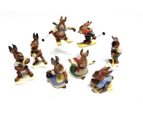 EIGHT GOEBEL RABBIT FIGURINES  comprising two skiers, a tobogganist, an ice-skater, a golfer, two tennis players, and a bowle