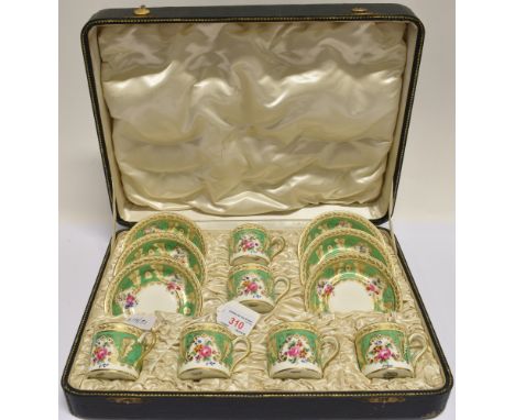 A CASED SET OF SIX CAULDON COFFEE CANS AND SAUCERS  with floral and gilt decoration, retailed by Goode and Co.