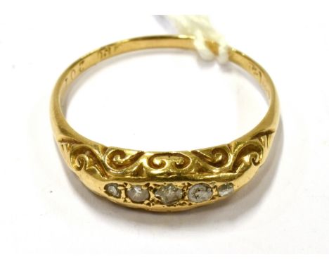 AN EARLY 20TH CENTURY SMALL DIAMOND GYPSY RING  set with three small diamonds and infilled with silver-solder(?), to an scrol
