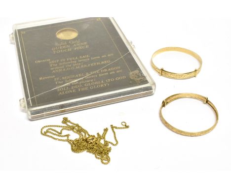 A MODERN CHILD'S 9CT GOLD EXPANDING BANGLE, ANOTHER AND A 9CT GOLD REPLICA QUEEN ANNE TOUCH PIECE  one bangle, with post 2000