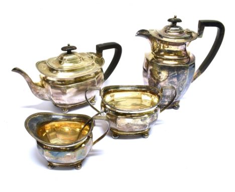 A SILVER FACETTED OBLONG FOUR PIECE TEA AND COFFEE SERVICE the teapot and coffee pot/hot water jug with ebonised angular scro