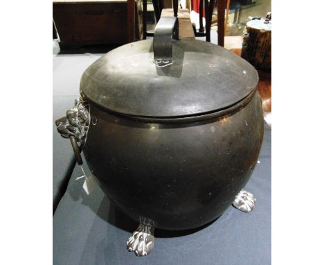 A LARGE COPPER COAL BIN  with brass lion mask ring handles and four paw feet, 42cm diameter