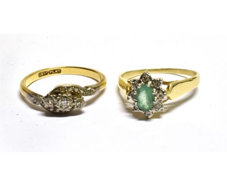 A MID-20TH CENTURY GOLD AND SMALL DIAMOND THREE STONE CROSS-OVER RING AND AN EMERALD AND DIAMOND OVAL CLUSTER RING the cross-