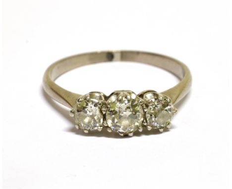 A MID-20TH CENTURY OLD-CUT DIAMOND THREE STONE RING  the graduated old-cut stones approx. 0.72cts total, all claw set in whit