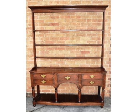 AN OAK DRESSER  the base with five drawers above pot shelf, 148cm wide 40cm deep 200cm high