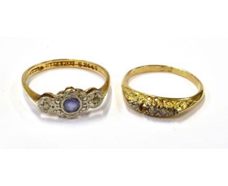 TWO EARLY 20TH CENTURY GOLD AND GEM RINGS INCLUDING AN ART DECO GOLD, SAPPHIRE AND DIAMOND THREE STONE RING the pale-blue rou