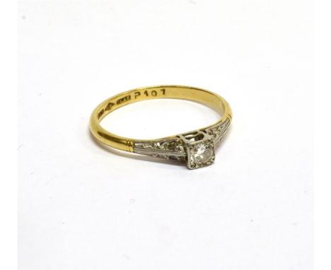 AN EARLY-MID 20TH CENTURY GOLD AND DIAMOND SOLITAIRE RING the round brilliant approx. 0.15cts, grain set within a square plat