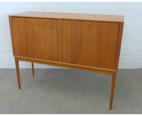 Retro mid 20th Century  teak cocktail drinks cabinet having a revolving door with a mirrored glass interior and a fall front 