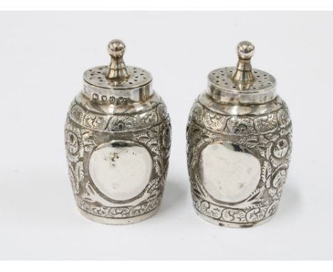 A pair of Victorian silver pepper pots, makers mark of Edward Hutton, London 1889, 5cm (2) 