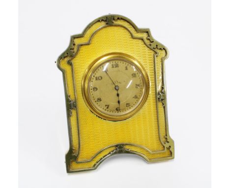 Silver gilt and yellow guilloche enamel desk clock, Charles &amp; Richard Comyns, London 1924, with 8 Day clock face with Ara