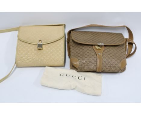 Two vintage Gucci handbags, both monogrammed and one with a Gucci padlock fastening, (2) 