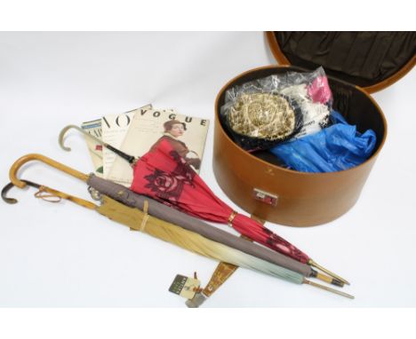 A vintage hat box containing as collection of costume jewellery, opera glasses, gloves, evening bags, etc  together with thre