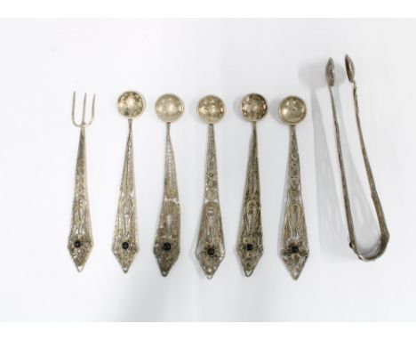 Eastern white metal filigree spoons, fork and sugar tongs, (7) 