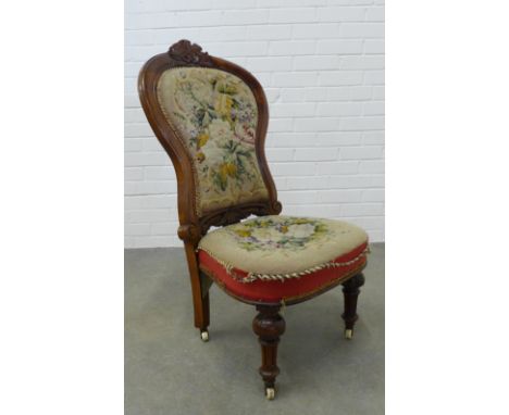 Victorian mahogany chair with floral carved top rail, tapestry upholstered back and stuff over seat, on fluted legs with bras