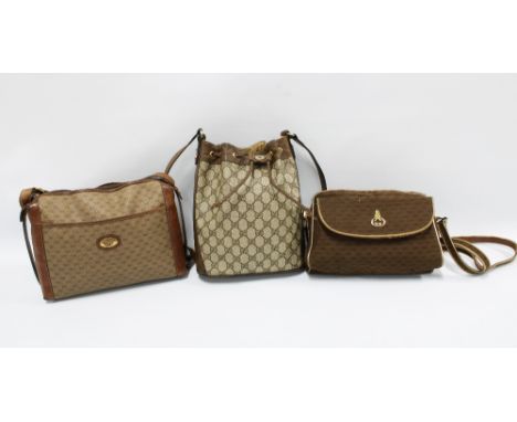 Three vintage Gucci handbags to include leather and canvas examples, all monogrammed throughout and with brown leather straps