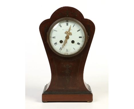 A Victorian mahogany balloon mantel clock with brass inlay. Housing a French eight day two train cylinder movement striking o