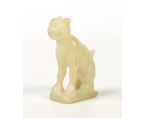 A Chinese carved yellow jade model of a dog seated on a rectangular plinth, 6.5cm.  Condition Report. To be used as a guide o