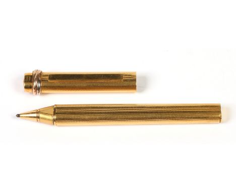 A Cartier gold plated roller ball pen with engine turned engraving. Seriel number 012212  Condition Report. To be used as a g